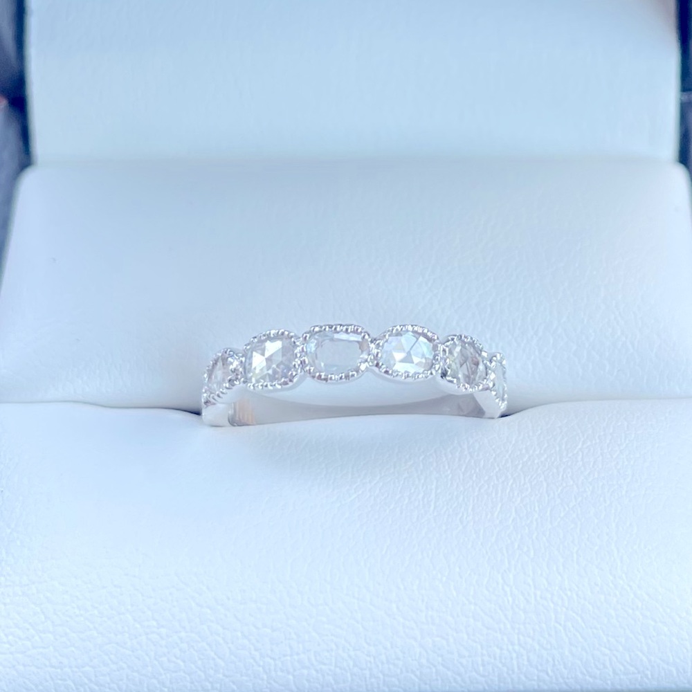 18kwg .52 ct organic rose cut
diamonds in milgrain bezels band.